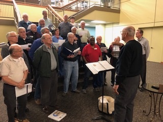 Rehearsing a few songs in the large hallway for the sound.